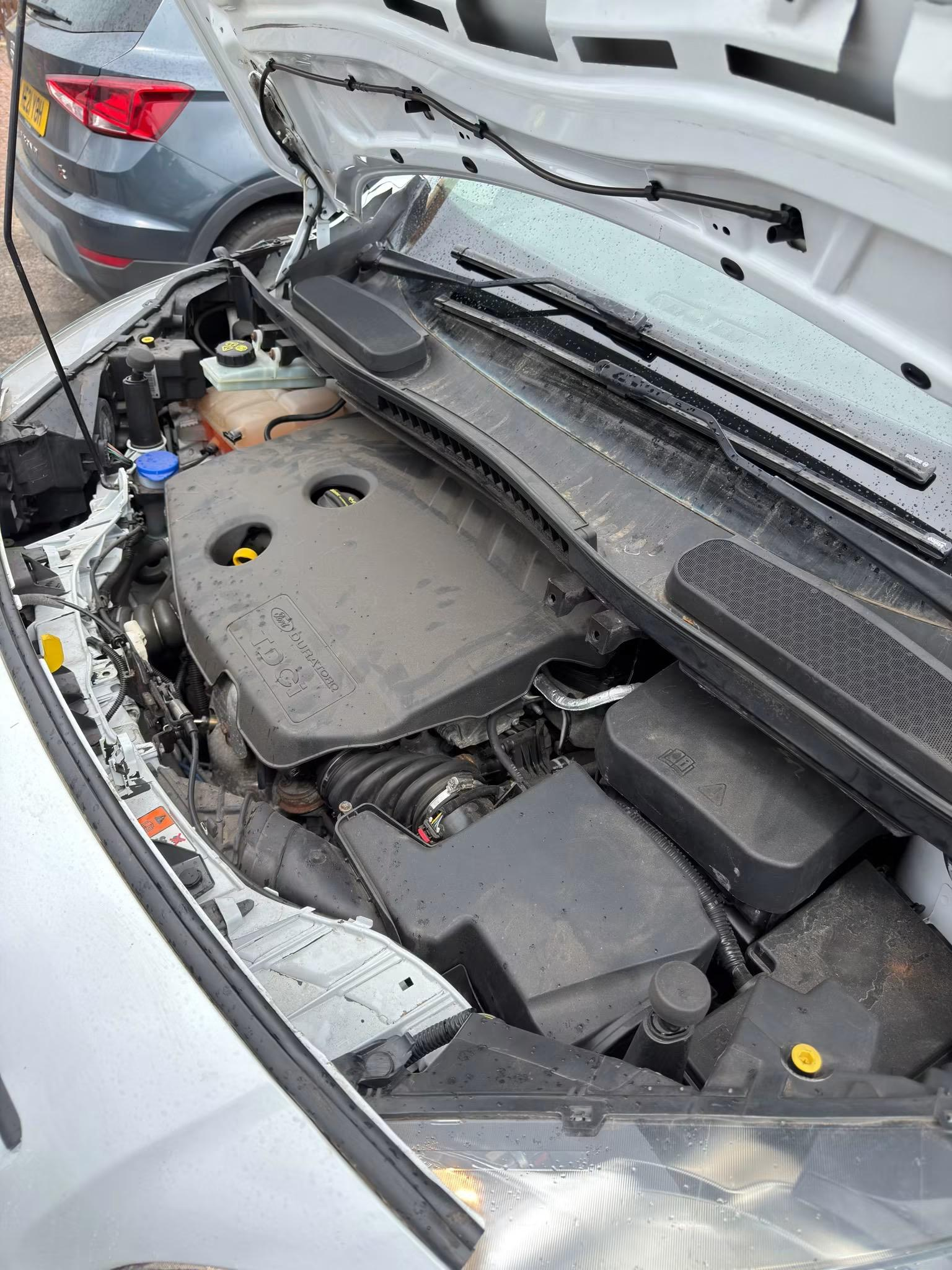 Ford engine bay before detailing